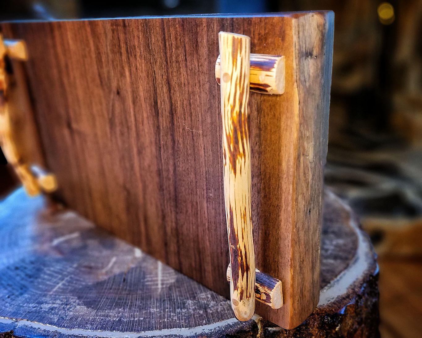 Walnut charcuterie board with mountain laurel handles