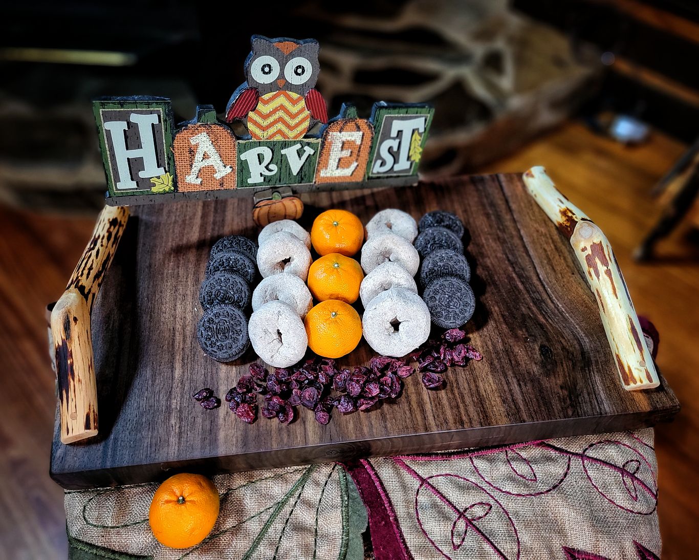 Autumn-themed charcuterie board with handles.