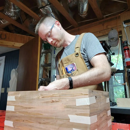 Greg Loebick, owner of G. Loebick Woodworks, crafting a humidor