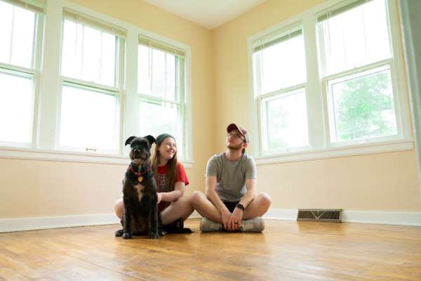 Couple with dog moving into a new home, the perfect space for a custom wood map
